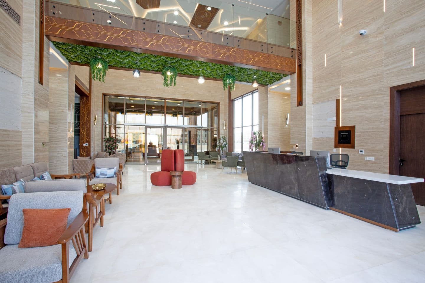 The grand lobby, with its living green ceiling feature and lounge seating