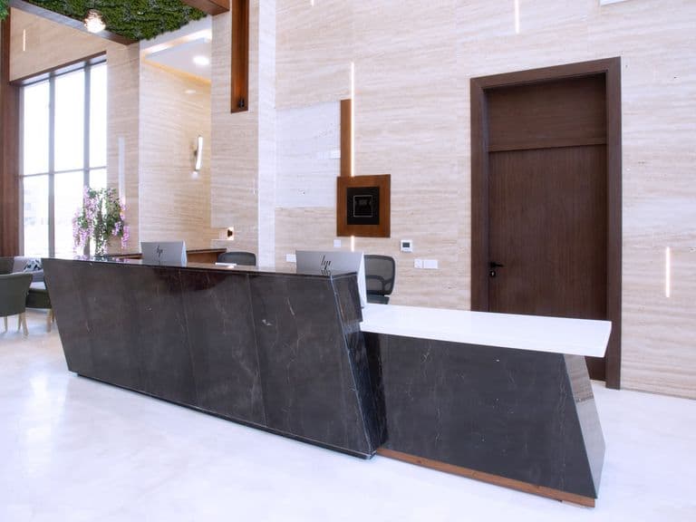 The reception desk in the hotel lobby