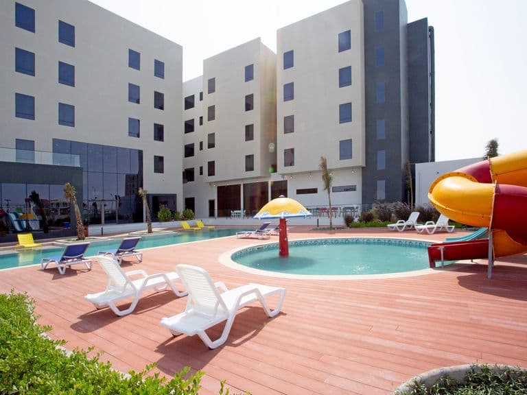 The children's pool and water slides beside the main pool