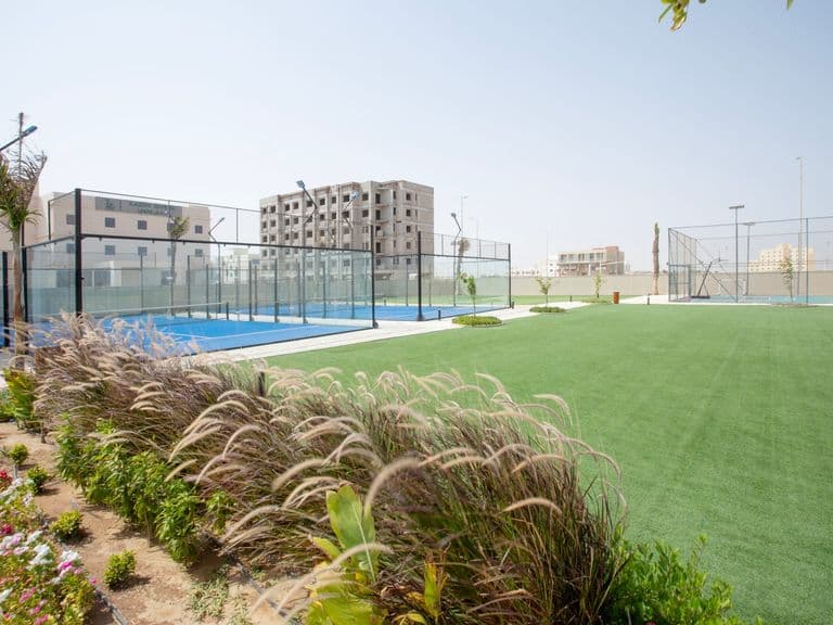 The padel courts alongside the recreation yard and gardens