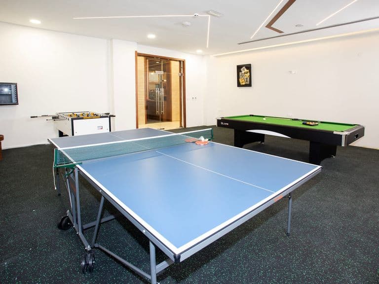 Table tennis and foosball in the games room