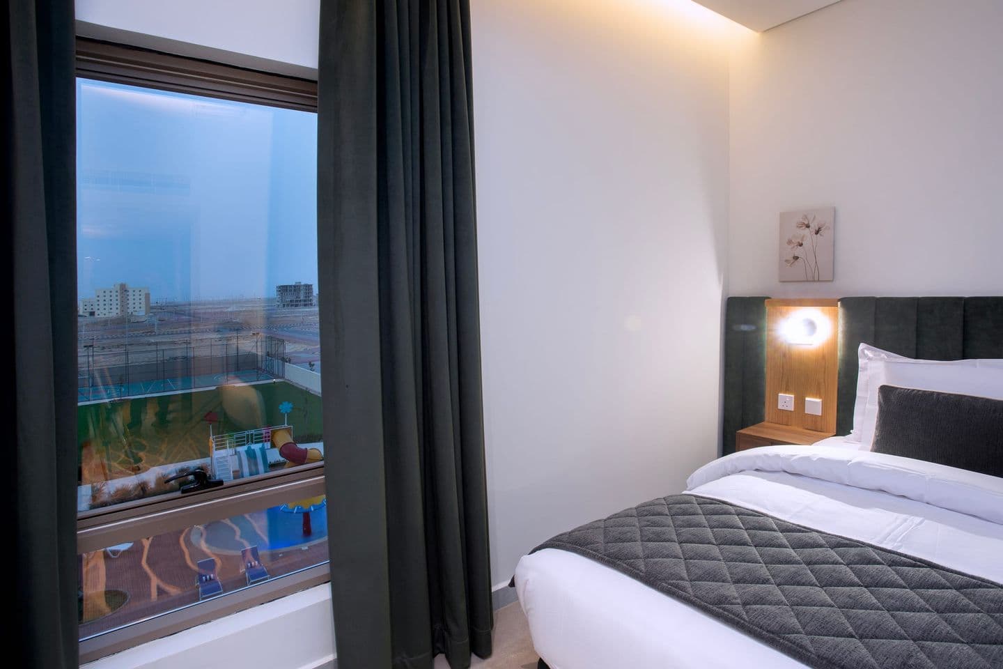 A guest room looking out over the pool terrace