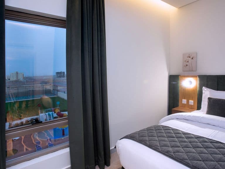 A guest room looking out over the pool terrace