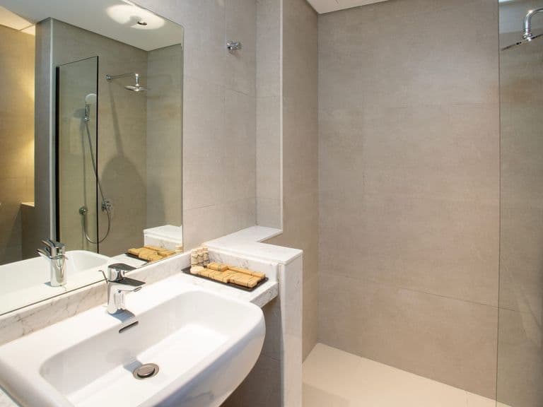 An en-suite bathroom with a walk-in shower