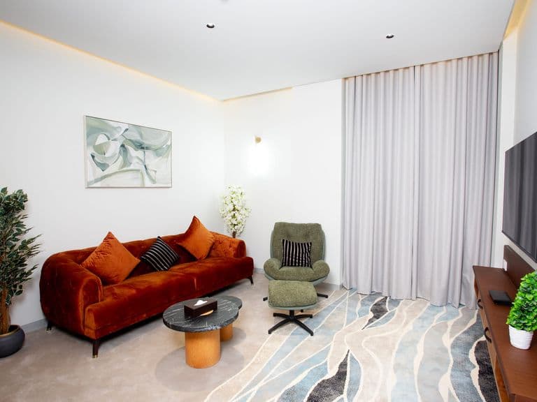 A suite living area with sofa and armchair
