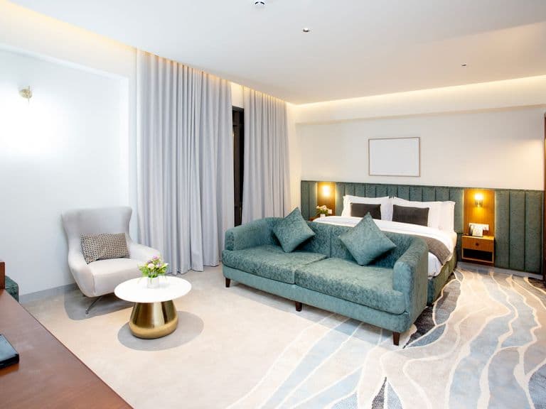 A suite, with the bedroom and seating area together