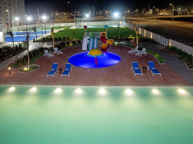 The pool and children's pool at dusk