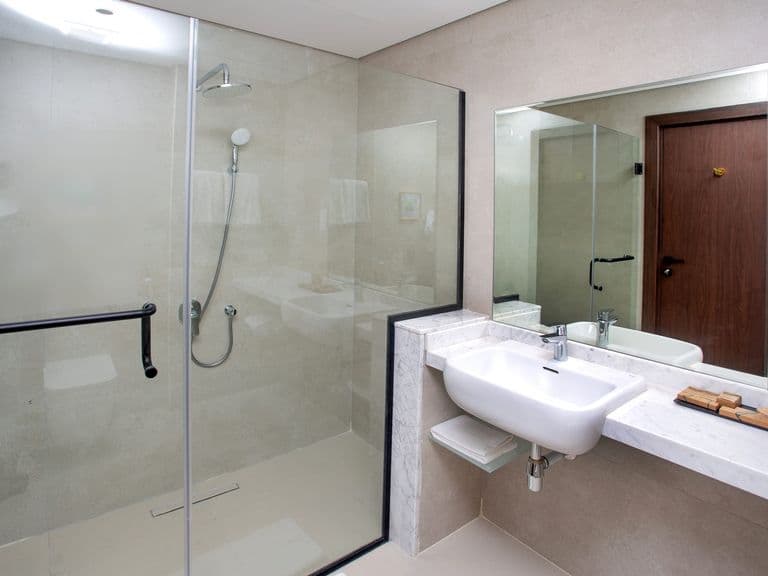 A bathroom with a walk-in shower
