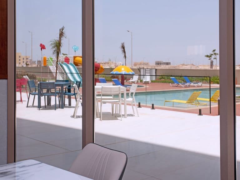Café seating with a view of the pool