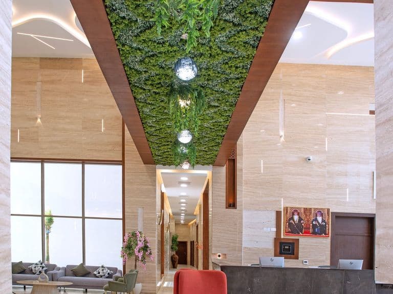 The lobby, beneath its green ceiling feature
