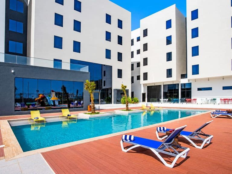 The swimming pool in the hotel courtyard, framed by the guest room wings
